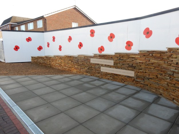 Patio with loose stone wall and embossed message on stone